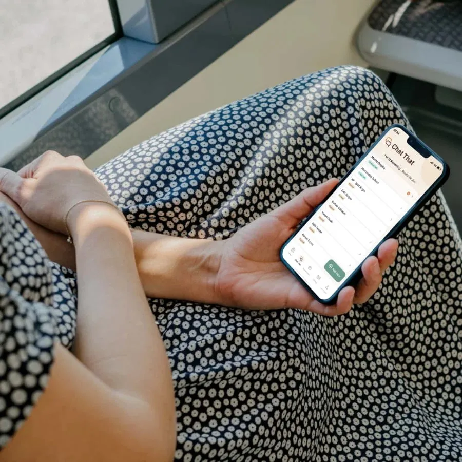 The DE.Me app shown on a phone